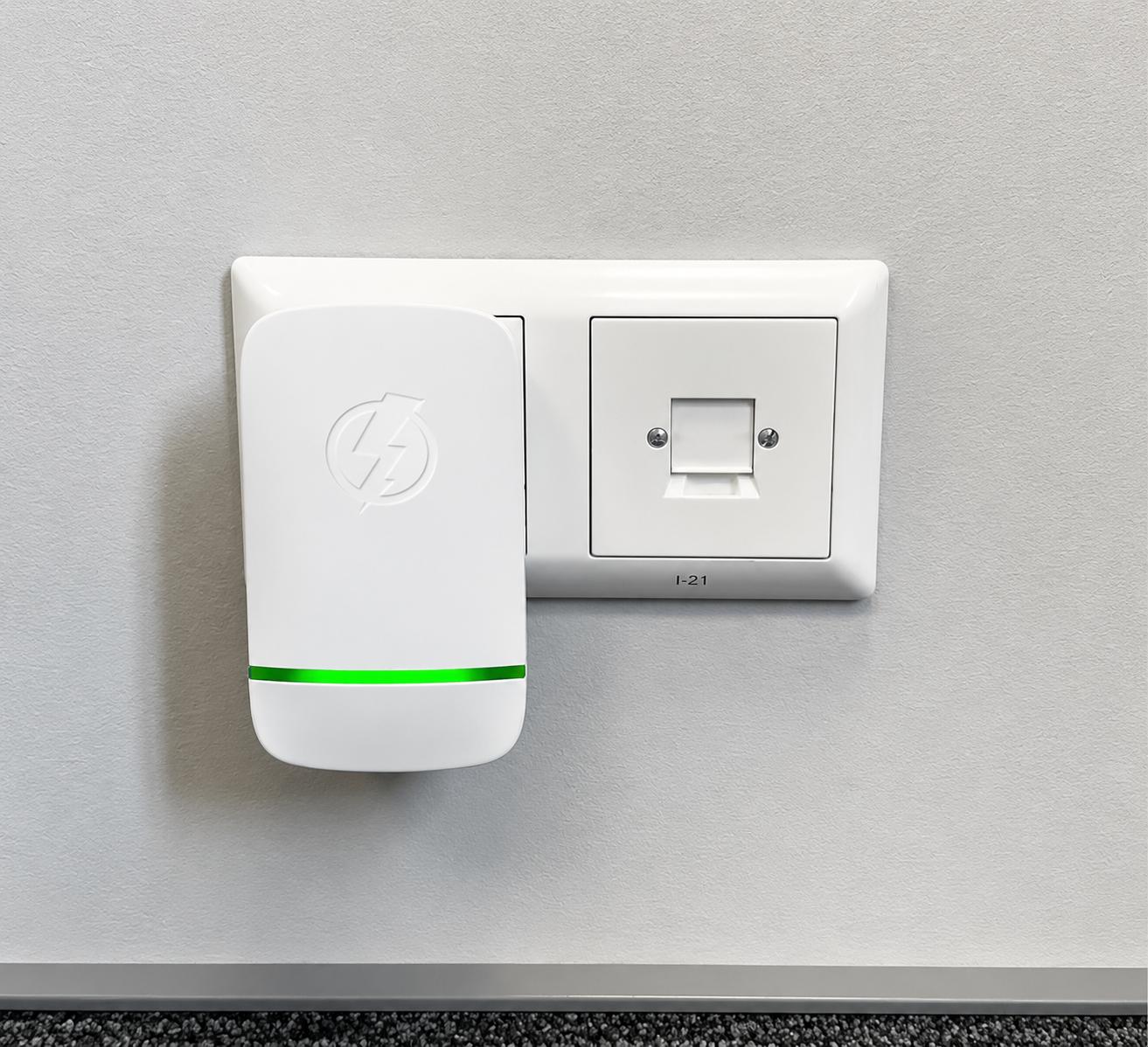 StopWatt plug-in device connected to a wall outlet